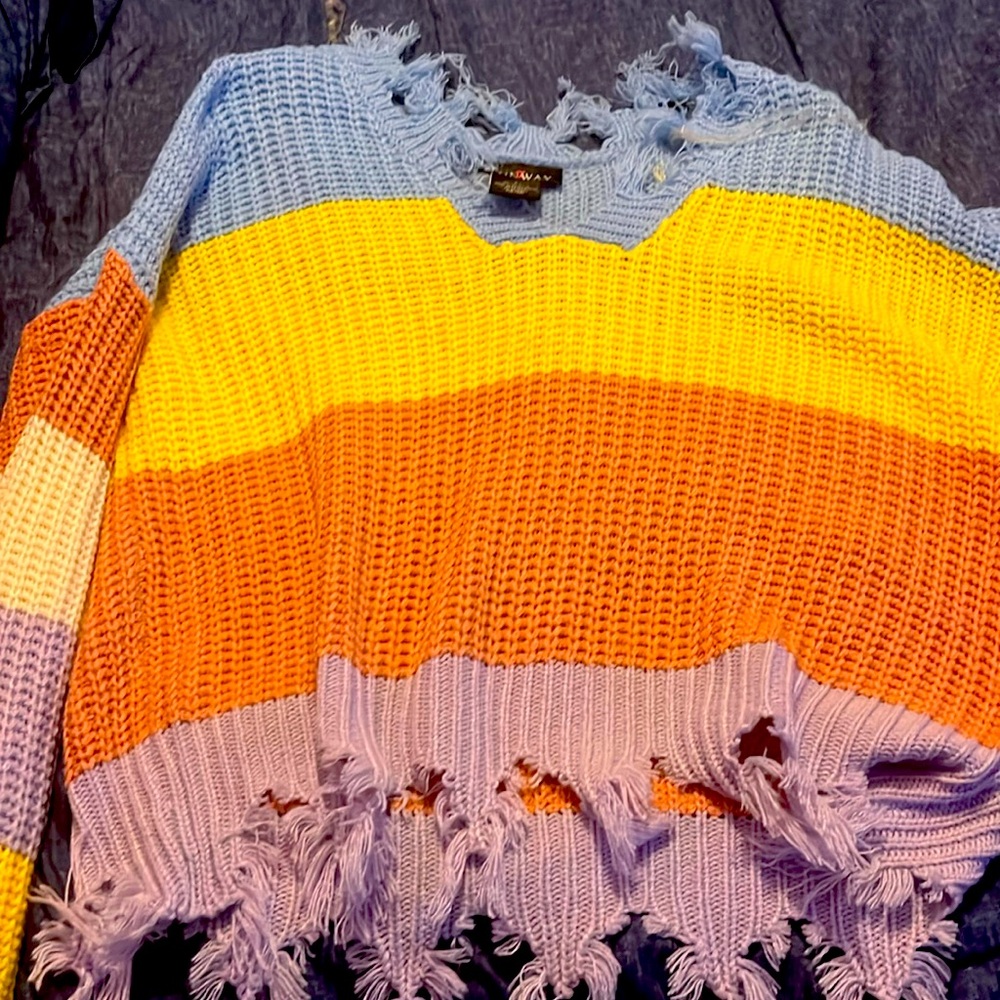 Multi color sweater.